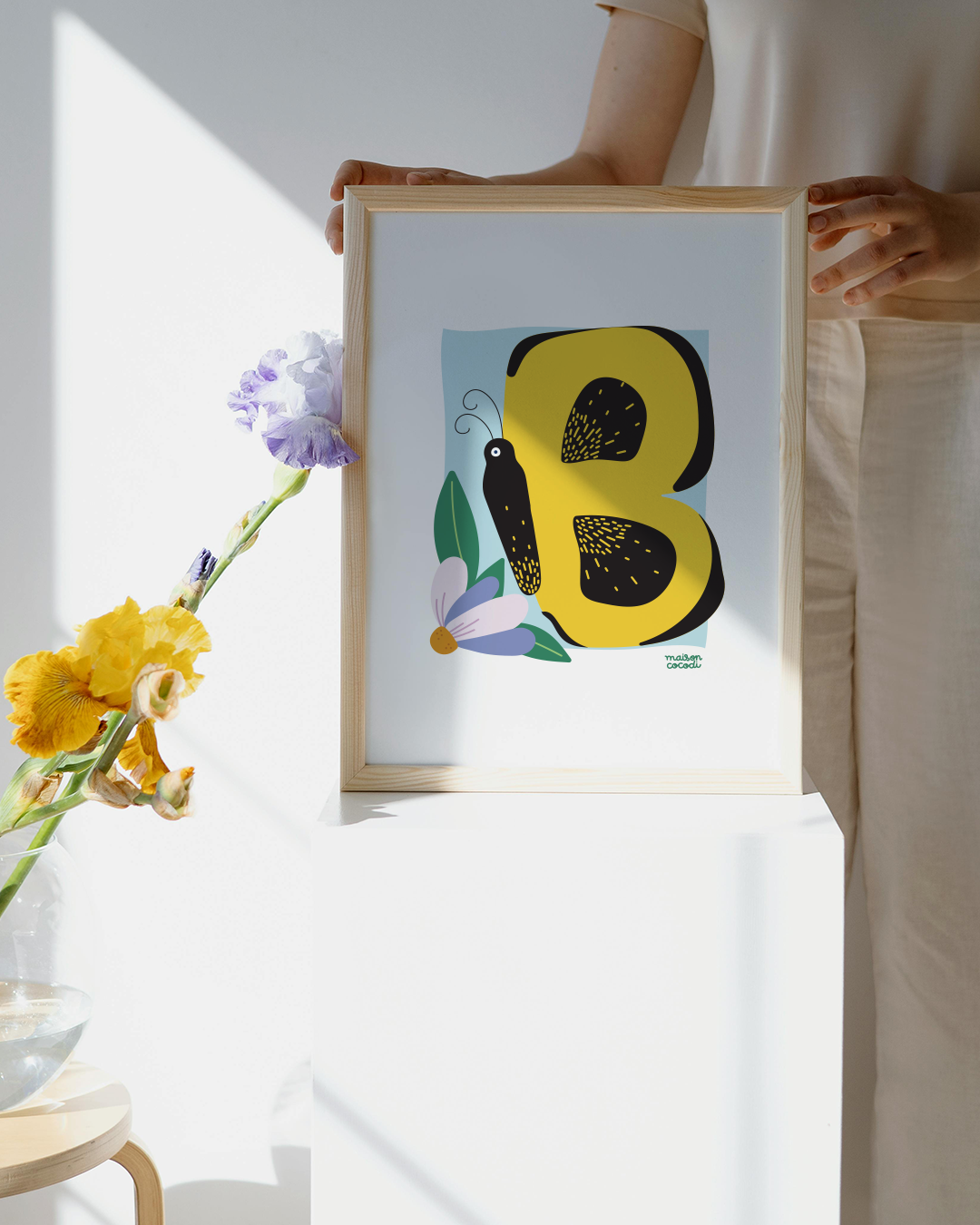 Alphabet Letter Poster for Babies: Butterfly shaped letter "B" Held by a woman